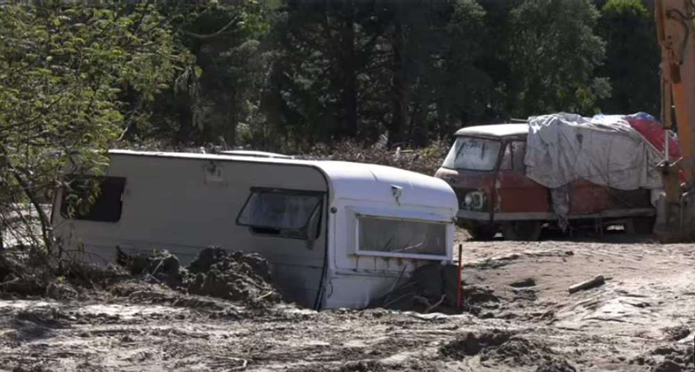 Esk Valley caravan and van half buried in silt