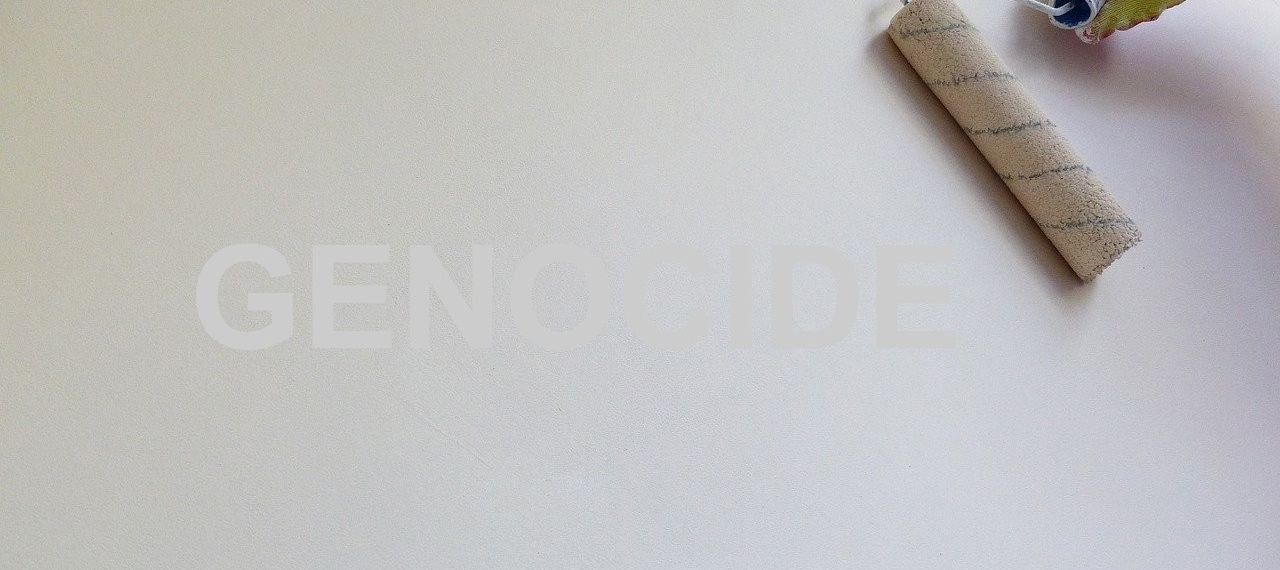 paint roller covering word genocide - pixabay