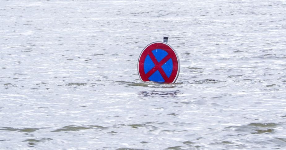 sign semi submerged in flood