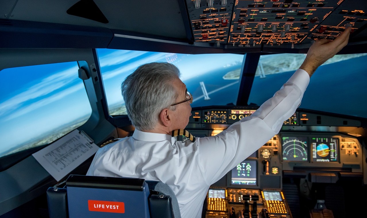 pilot in cockpit flyin aircraft