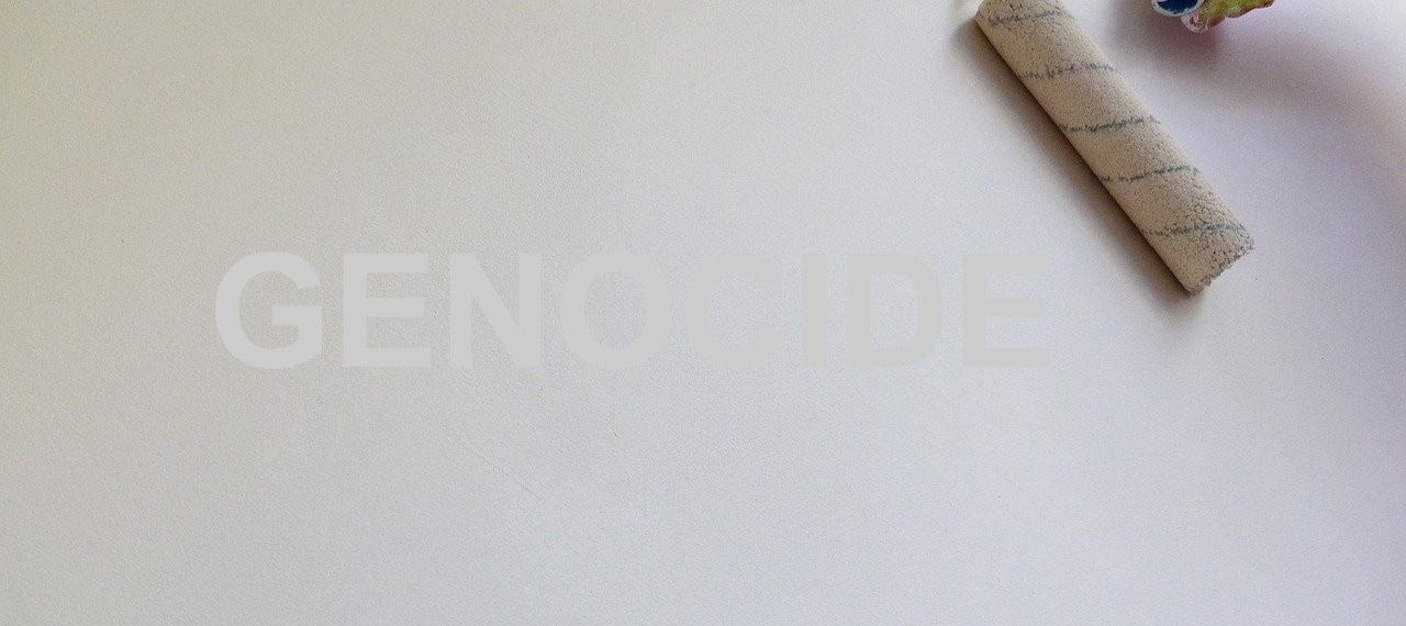 paint roller covering word genocide