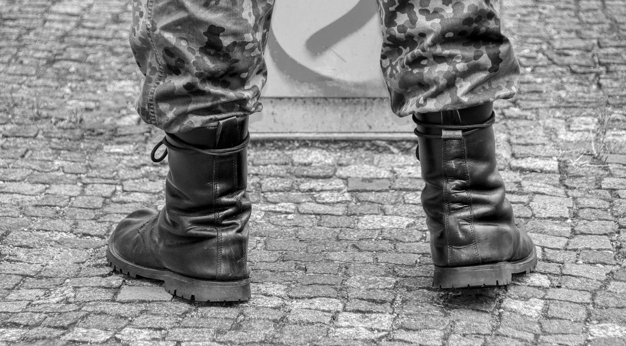 legs and feet of soldier in uniform