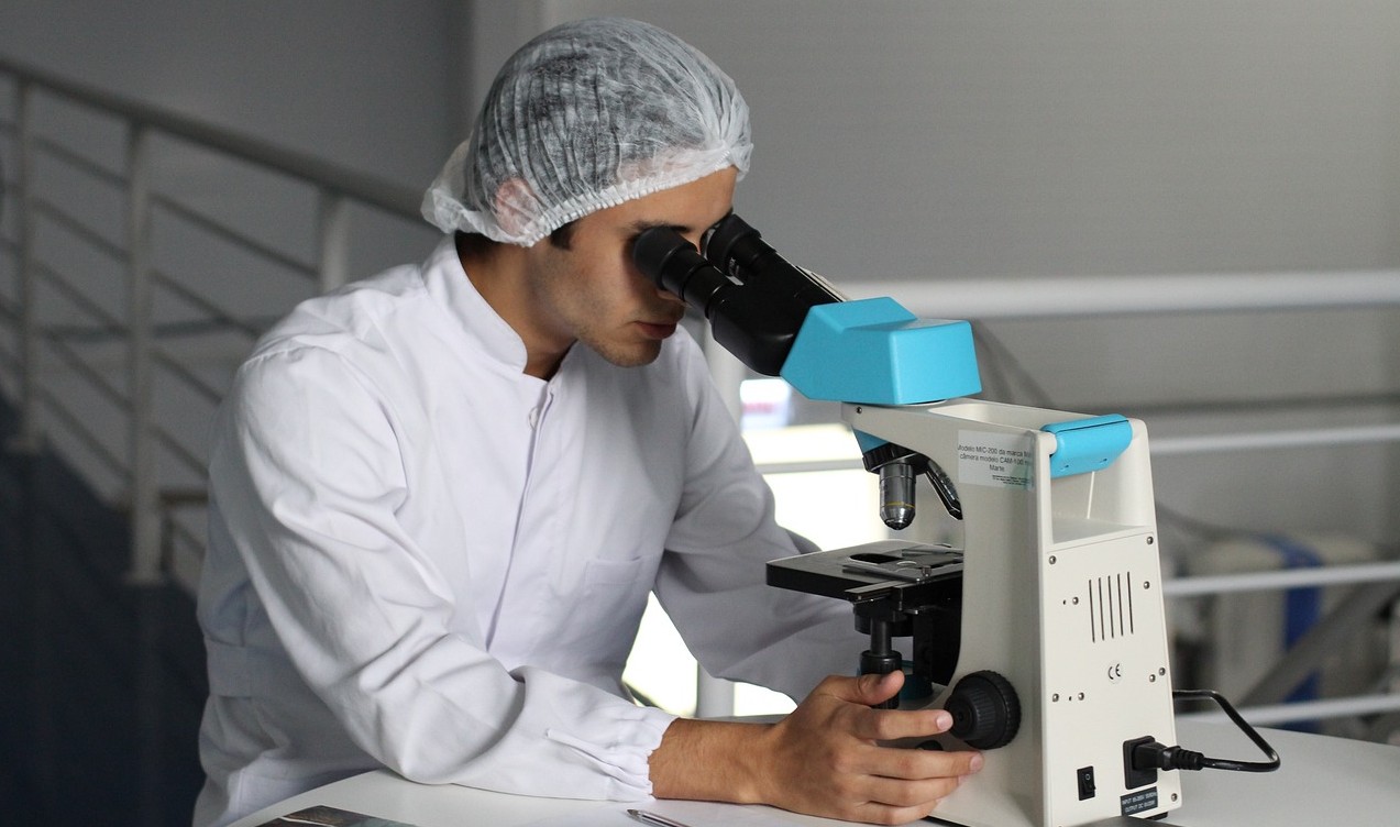 scientist with microscope
