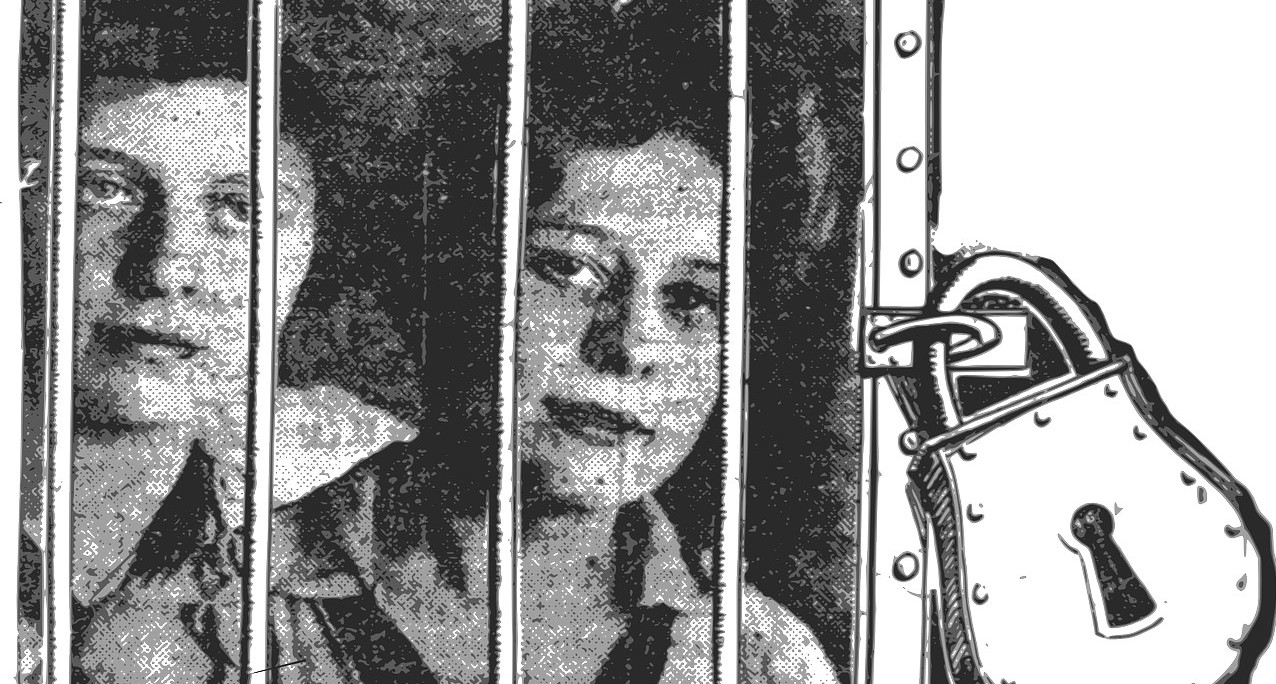two women behind bars