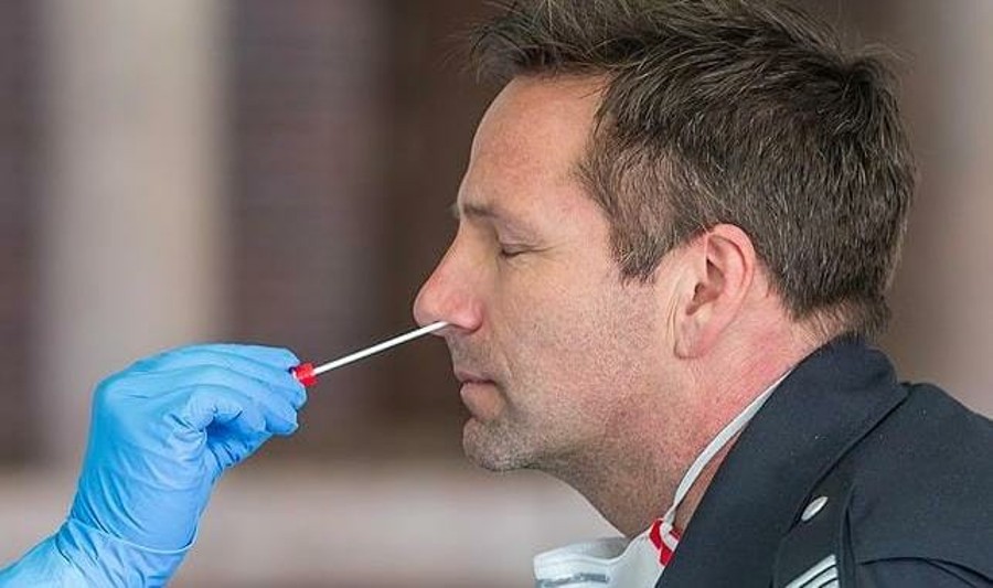 man_taking_pcr_nasal_swab