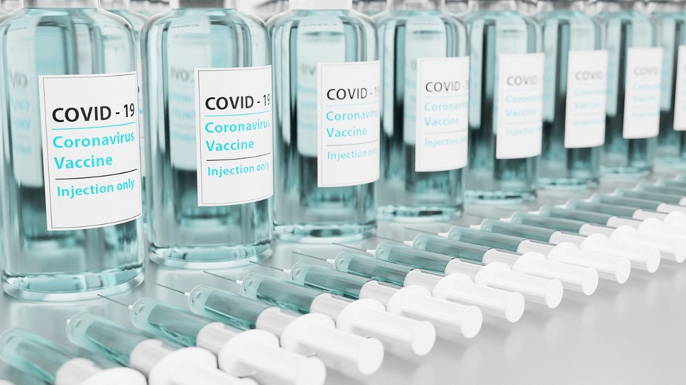 covid-19 vaccine vials and syringes